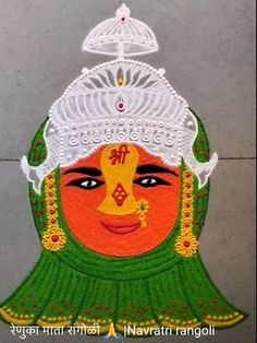 an image of a woman's face painted in white and green with the words happy navrath rangoli on it