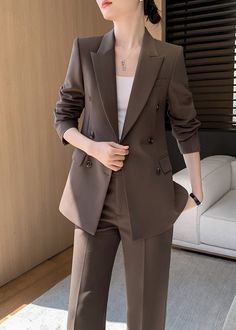 Introducing the ultimate in elevated style and effortless sophistication - the Ruby Brown Double Breasted Blazer Wide Pants Suit Two-Piece Set. Featuring a rich shade of mocha brown and a relaxed yet tailored fit, this suit exudes luxury and refinement. Perfect for making a statement in any setting. Blazer: Double Breasted closure Notched lapels Long sleeves Front flap pockets Pants Zip fly with button closure Side slant pockets Regular length - Polyester, spandex- Item #432605- Women's blazer & Blazer Professional Outfits, Brown Sets For Workwear, Brown Workwear Sets With Suit Collar, Brown Workwear Sets For Fall, Brown Fall Pantsuit For Office, Brown Sets For Workwear In Fall, Chic Brown Pantsuit For Work, Elegant Brown Workwear Sets, Brown Double-breasted Suit With Pockets