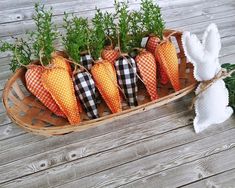 some carrots are sitting in a basket on the table