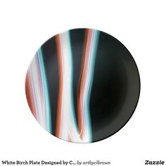 a black plate with multicolored lines on it