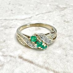 Vintage 14K Yellow Gold Natural Emerald & Diamond Ring - 14K Gold Emerald Ring - Cocktail Ring - Promise Ring - April May Birthstone Ring Vintage 14 karat yellow gold cocktail ring set with 3 natural round emeralds weighing approximately 0.20 carat.  It is surrounded by approximately 0.05 carat of near colorless single cut diamonds that are slightly included (SI clarity).  Size 4 US / H 1/2 UK / 46 3/4 FR. > Ring sizing not included.  This ring can be sized to fit most fingers.  If you need to s Yellow Gold Cocktail Ring, May Birthstone Rings, Emerald Ring Gold, Emerald Diamond Ring, Ring Vintage, Platinum Ring, Natural Emerald, Emerald Diamond, Gold Platinum