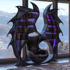 a book shelf with books in the shape of a dragon's wings is next to a window