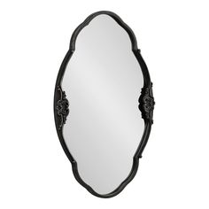 an ornate black mirror on a white background