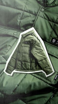 a green jacket with a white sticker on it