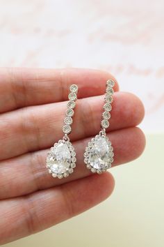 Tiny Vintage Style Bridal Earrings, Art Deco Earrings, Wedding Earrings Tiny  vintage style zircon  earrings  Colour: rhodium(silver tone) /clear Measurements: approx 3.6 cm x 1cm .  Materials:  rhodium components, zircon crystals . Stud earrings. Great for wedding or other celebration. MORE SAME STYLE: https://www.etsy.com/uk/shop/BridalArtDeco?ref=listing-shop-header-item-count&section_id=23918122 Please note some images have been enlarged to allow for details to be shown. Read the description Dangle Bridal Earrings With Prong Setting, Dangle Bridal Earrings With Prong Setting As Gift, Classic Bridal Earrings With Sparkling Stones, Hand Set Teardrop Chandelier Earrings For Gift, Hand-set Crystal Dangle Earrings, Hand Set Crystal Dangle Earrings, Dangle Linear Earrings With Prong Setting For Wedding, Hand-set Silver Bridal Earrings For Marriage, Teardrop Cluster Earrings For Wedding