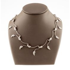 Kathy Lynn Mayeda 925 Sterling Silver Vine Necklace 17" Gorgeous Ivy Vine Motif Sterling Silver Chain Necklace 17" Long Total Mass = 19.0 grams Necklace is in good condition. Shows few signs of aging or wear. See photos for details. Reference Item #AV-6413 JP 7/14/2023 Ivy Necklace, Vine Necklace, Ivy Vine, Sterling Silver Chain Necklace, Silver Chain Necklace, Sterling Silver Chains, Chains Necklace, Ivy, Silver Chain