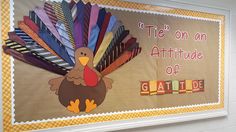 a bulletin board with a turkey on it and words that say tie on an attitude or gatlie