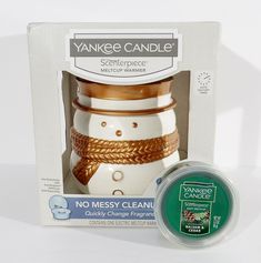 Add some festive charm to your home decor with this Yankee Candle Snowman Scenterpiece Melt Cup Warmer. The ceramic warmer is designed in the shape of a snowman with a white and gold color combination that blends well with any room decor. This candle warmer is suitable for melt cups and features an auto shut-off timer for safe usage. The warmer is a medium-sized free-standing accessory that can be placed in any room. It is perfect for use during the winter season and has a Christmas and snowman Cup Warmer, Gold Color Combination, Candle Warmer, Yankee Candle, Color Combination, Winter Season, Free Standing, The Winter, Gold Color