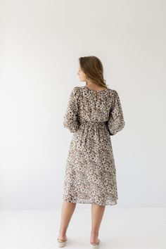 A favorite that has been brought back in a new print with long sleeves, the 'Ramona' now features a beautiful floral design that has endless styling possibilities. Pair with low heels and a clutch for a charming fall wedding guest look! Exclusively designed by us with you in mind. 100% Polyester Lined Waist Down Hand Wash Cold Hang or Lay Flat to Dry Do Not Bleach Iron Low Heat If Needed Do Not Dry Clean Maternity/Bump Friendly! Model Height 5'7" | Wearing Size Small Model Height 5'8" | Wearing Modest Cream Floral Print Dresses, Beige Floral Print Midi Dress, Cream Long Sleeve Midi Dress With Floral Print, Long Sleeve Cream Midi Dress With Floral Print, Long Sleeve Cream Floral Midi Dress, Cream Floral Print Midi Dress For Brunch, Beige Printed Fall Dress, Beige Midi Dress With Ditsy Floral Print, Fall Brunch Midi Dress With Ditsy Floral Print