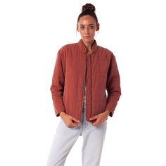 Free, postage-paid returns on all US clothing orders Rhythm's Santiago Jacket is a lightweight quilted bomber that is fully lined with side pockets, a partially elasticated hem, and a Mandarin collar for warmth and functionality. 100% Tencel Lightweight quilted puffer jacket Metal zipper Fit is true to size Designed in Australia