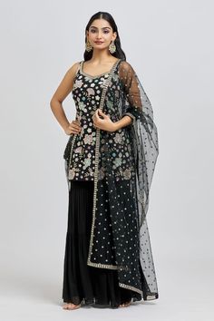 Black kurta with all over embroidery in floral pattern using sequin, cutdana, beads, thread and zari work. Paired with a sharara and dupatta with sequin butti embroidery. - Aza Fashions Designer Floral Embroidered Chinon Lehenga, Designer Wear Lehenga With Floral Embroidery, Designer Sharara With Intricate Embroidery And Straight Kurta, Anarkali Lehenga With Floral Embroidery In Chinon, Festive Dola Silk Sets With Floral Embroidery, Floral Embroidered Party Sets For Transitional Seasons, Anarkali Palazzo Set With Intricate Multicolor Embroidery, Fitted Art Silk Sharara With Floral Embroidery, Festive Anarkali Set With Floral Embroidery In Dola Silk