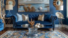 a living room with blue couches, gold accents and art work on the wall