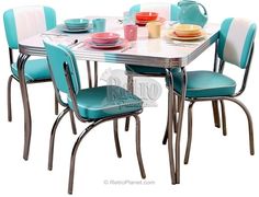 a dining table with four chairs around it