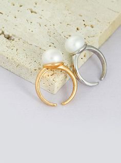 Product Details:Material: S925 silver/natural pearlSize: The pearl is about 11mm, and the adjustable finger ring is about US size 6~8Describe:Introducing our Pearl Ring: A sleek and sophisticated accessory that effortlessly enhances your daily attire. Crafted with genuine S925 silver and adorned with natural pearls, available in both classic silver and vintage gold. Elevate your look with this timeless piece that exudes confidence and refinement. Minimalist Pearl Rings With Pearl Charm, Minimalist Pearl Drop Ring, Elegant Open Ring With Pearl Charm, Minimalist Pearl White Pearl Ring, Minimalist Formal Pearl Drop Ring, Classic White Pearl Ring With Simple Design, Elegant Open Pearl Ring With Metal Band, White Pearl Ring With Simple Design For Anniversary, Minimalist Pearl Open Ring With Simple Design