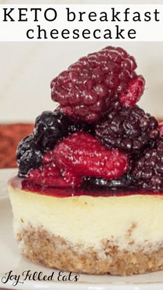 a cheesecake with berries on top and the words keto breakfast cheesecake above it