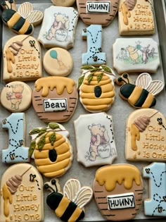 decorated cookies in the shape of animals and bees