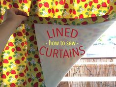 someone is holding up a banner with the words lined how to sew curtains on it