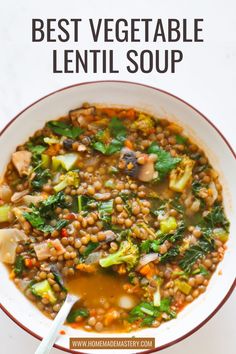 a white bowl filled with lentil soup on top of a table