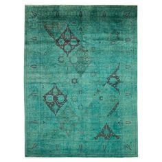 a green rug with an intricate design on the top and bottom, in different colors