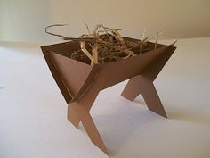 an origami bird's nest is shown in the shape of a dog