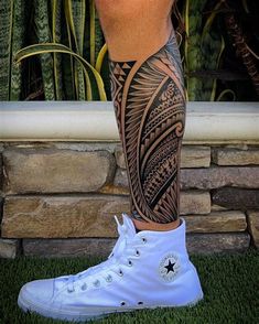 a man's leg with a tattoo on it