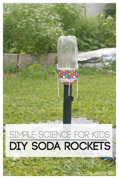 a diy soda rocket sitting on top of a green field