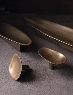 three metal objects are laying on the floor