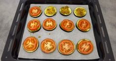 tomatoes on a baking sheet ready to be cooked in the oven for dinner or dessert