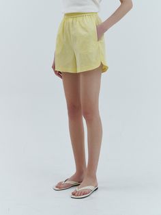 Editor's NotesThese are short pants made of breathable fabric with a waist banding detail providing a comfortable fit. You can wear these pants with a sleeveless top and a simple white shirt to complete a stylish vacay outfit.- Polyester material half pants- High-waisted design, short length- Side pockets for convenience- Come in a beautiful lemon colorMeasurements(in.)S / M- Length: 15.75 in. / 16.14 in.- Waist: 13.58 in. / 14.57 in.- Hips: 19.49 in. / 20.47 in.- Thigh: 12.80 in. / 12.99 in.- Hem: 12.40 in. / 12.60 in.- Rise: 12.80 in. / 12.99 in.*Measurements may not fully match within 0.8.*Model info: Height 5’10” Bust 12 in. Waist 9 in. Hips 14 in. Fitting Size SComposition & Care- 100% Polyester- Dry cleaning recommended- Do not tumble dry*When removing contamination, pl Relaxed Bottoms With Built-in Shorts For Summer, Relaxed Fit Bottoms For Summer Day Out, Short Leg Pants For Beach, Solid Color Short Leg Beach Pants, Chic Relaxed Fit Beach Shorts, Relaxed Summer Loungewear Bottoms, Chic Summer Cotton Bottoms, Summer Beachwear Bottoms With Relaxed Fit, Relaxed Fit High-waisted Summer Shorts