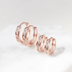 These Rose Gold Vermeil Huggie Hoop earrings will be your favorite everyday pairs. Our Huggies are true to size and will hug your ear perfectly. Great for smaller lobes or second piercings. 14K Rose Gold over Sterling Silver Cubic Zirconia Crystals Hypoallergenic, lead and nickel free Thickness 2mm Inside Diameter Sizes: 6.5mm, 9mm Snap closure #E008-RG Second Piercings, Second Piercing, Types Of Piercings, Huggie Hoop Earrings, Hoop Earrings Small, Jewelry Inspo, Rose Gold Earrings, Gold Charm, Huggies Earrings