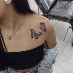 a woman with a butterfly tattoo on her shoulder