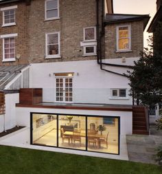 an extension to a house with glass walls