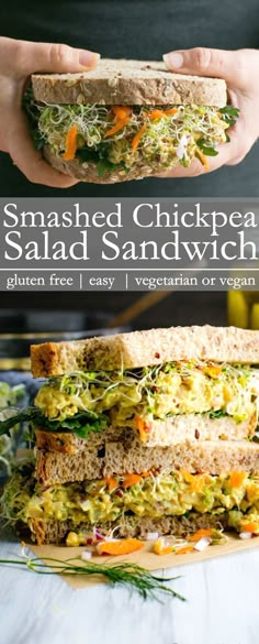 a sandwich is stacked high with shredded vegetables and lettuce