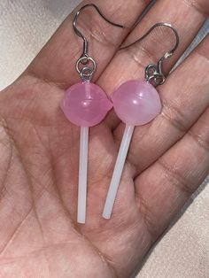 "Fun LOLLIPOP earrings. Colors are pink and white. Style: Hipster, punk, Kitsch, goth, gothic, punk, Kawaii, Boho, Hippie, Retro.  For pierced ears. Perfect for Valentines and Halloween. Great Birthday gift. approximate measurements: body of earrings: 1 5/8\" L x 5/8\"W drop of earrings: 2 5/8\" L" Playful Pink Round Earrings, Pink Novelty Dangle Jewelry, Sweet Pink Dangle Jewelry, Pink Round Earrings For Birthday, Pink Round Birthday Earrings, Pink Fun Dangle Jewelry, Fun Pink Dangle Jewelry, Sweet Pink Drop Earrings, Sweet Pink Nickel-free Jewelry