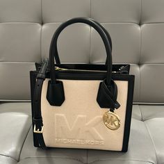 Black Medium Mercer With An Attachment To A Crossbody Michael Kors Black Satchel For Daily Use, Michael Kors Black Top Handle Satchel, Michael Kors Black Top Handle Bag, Michael Kors Black Tote Satchel, Michael Kors Black Everyday Satchel, Chic Black Michael Kors Bag, Michael Kors Black Shoulder Bag With Detachable Handle, Michael Kors Black Double Handle Satchel, Michael Kors Black Double Handle Bags