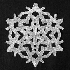 a snowflake is shown on a black background