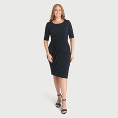 Meet the Lisa Black Faux Wrap Dress – where sophistication meets comfort effortlessly. Slip into style with this chic and versatile dress that combines a classic silhouette with modern convenience. Lisa is more than just a dress; she’s a statement of elegance and ease. Designed with elbow sleeves, Lisa strikes the ideal balance between modesty and contemporary flair. Her faux wrap design adds a touch of sophistication, making her perfect for various occasions, whether it's a day at the office or Office Ruched Midi Length Dresses, Chic Ruched Dress For Work, Knee-length Dress For Business Casual, Ruched Midi Dress For Work, Flattering Formal Midi Dress For Fall, Flattering Formal Fall Midi Dress, Flattering Fall Workwear Dresses, Sleek Sheath Dress For Fall, Solid Color Sleek Formal Dress