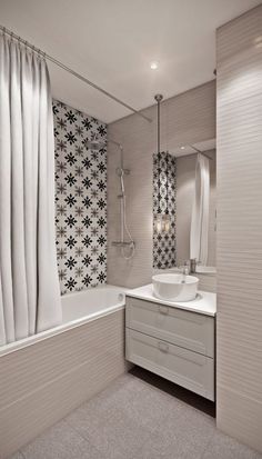 a bathroom with a sink, bathtub and shower curtain in the corner by the window