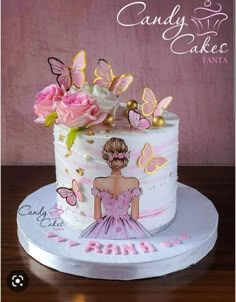 a cake decorated with pink flowers and butterflies