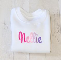 a white t - shirt with the word mellie painted on it's chest