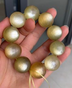 Material:golden mica beads size :  20mm quantity: one strand  6mm approx 29 pcs one strands 7mm approx25 pcs one strands 8mm approx 22 pcs one strands 9mm approx 21pcs one strands 10mm approx 19 pcs one strands 11mm approx 18pcs one strands 12mm approx 16 pcs one strands 13mm approx 16 pcs one strands 14mm approx 15 pcs one strands 15mm approx 14pcs one strands 16mm approx 14 pcs one strands 17mm approx 13pcs one strands 18mm approx 13pcs one strands 19mm approx 12pcs one strands 20mm approx 12p Handmade Gold Beaded Round Bracelets, Gold Bracelets With Polished Beads For Healing, Handmade Gold Beaded Bracelets, Gold Bracelets With Large Beads, Gold Beaded Bracelet With Large Beads For Gift, Gold Beaded Bracelets With Large Beads As Gift, Gold Hand-strung Round Beads, Gold Beaded Bracelets With Large Beads, Spiritual Gold Beaded Bracelets With Large Beads