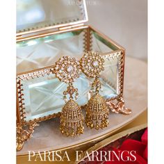 Sparkle with every sway, dazzle with every gaze! Exquisite dangling earrings encrusted with gleaming CZ stones that radiates a brilliance that is simply mesmerizing. Approximate earrings length is 3.2" Gold-plated on high-quality brass as base metal. Made by order. Kindly allow 5-7 weeks for the delivery of this item. For custom or urgent requests, please contact support@alacouture.com. *Please Note: We use faux stones and beads in all of our jewelry. Elegant Gold-plated Chandelier Earrings, Luxury Gold Plated Chandelier Earrings, Elegant Gold-plated Chandelier Earrings With Intricate Design, Luxury Gold-plated Chandelier Dangle Earrings, Gold-tone Gold Plated Chandelier Earrings, Heritage Jewellery, Waist Chain, Faux Stone, Head Accessories