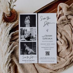 the wedding stationery is laid out on top of an old blanket and some fur