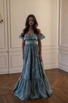 Adorned with Monet's shimmering water lilies, this cotton maxi dress features off-shoulder ruffle straps and an elegant bow closure at the waist. Its flowing single-layer skirt and exquisite pleated ruffle hemline, which can be easily hemmed to your desired length, make it perfect for enchanting guests at the Ritz Pari Shimmering Water, Silk Dressing Gown, Layer Skirt, Corset Skirt, Puff Dress, Cotton Maxi Dress, The Ritz, Cotton Maxi, Maxi Dress Cotton