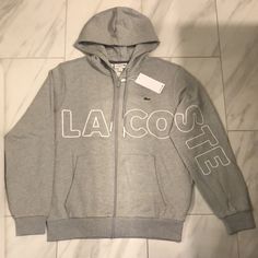 Men’s Lacoste Full Zip Hoodie Price Is Firm At $90. Color: Gray/White Condition: 10/10 New W Tags Casual Hoodie Outerwear With Logo Detail, Casual Hooded Outerwear With Logo, Lacoste Shirts Men, Lacoste Hoodie, Zipup Sweater, Lacoste Sweatshirt, Mens Fleece Hoodie, Dark Grey Hoodie, Zipup Hoodie