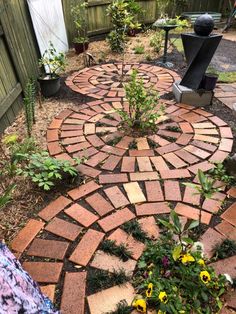 a brick path in the middle of a garden