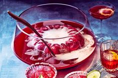 a table topped with drinks and desserts