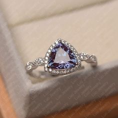 This ring features a 8*8 mm trillion cut lab alexandrite. Customization is available. It is made by hand, and it will take about 7 days to finish the ring after your payment is completed.  Main stone: 8*8 mm trillion cut lab alexandrite Main stone weight: 0.00 ct Metal type: sterling silver /14k gold Accent stone: cz   Customization is available, just fee free to contact me, it is free to engrave inside the ring, it is free, you can leave a ntoe with your order, but it will be great no more than 15 letter. Any question, just let me know. :) My shop homepage: https://www.etsy.com/shop/LuoJewelry?ref=l2-shopheader-name Trillion Cut Ring, June Birthstone Ring, Silver Engagement Ring, Alexandrite Ring, Tanzanite Ring, Sterling Silver Engagement Rings, Silver Wedding Rings, Jewelry Lookbook, June Birthstone