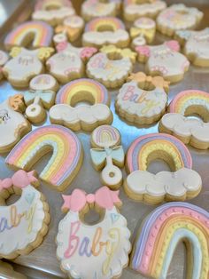 baby shower cookies are arranged on a cookie sheet