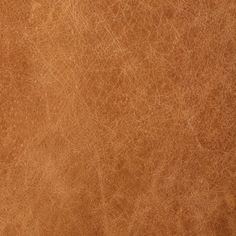 a brown leather texture background or wallpaper that looks like it has been scratched and stained